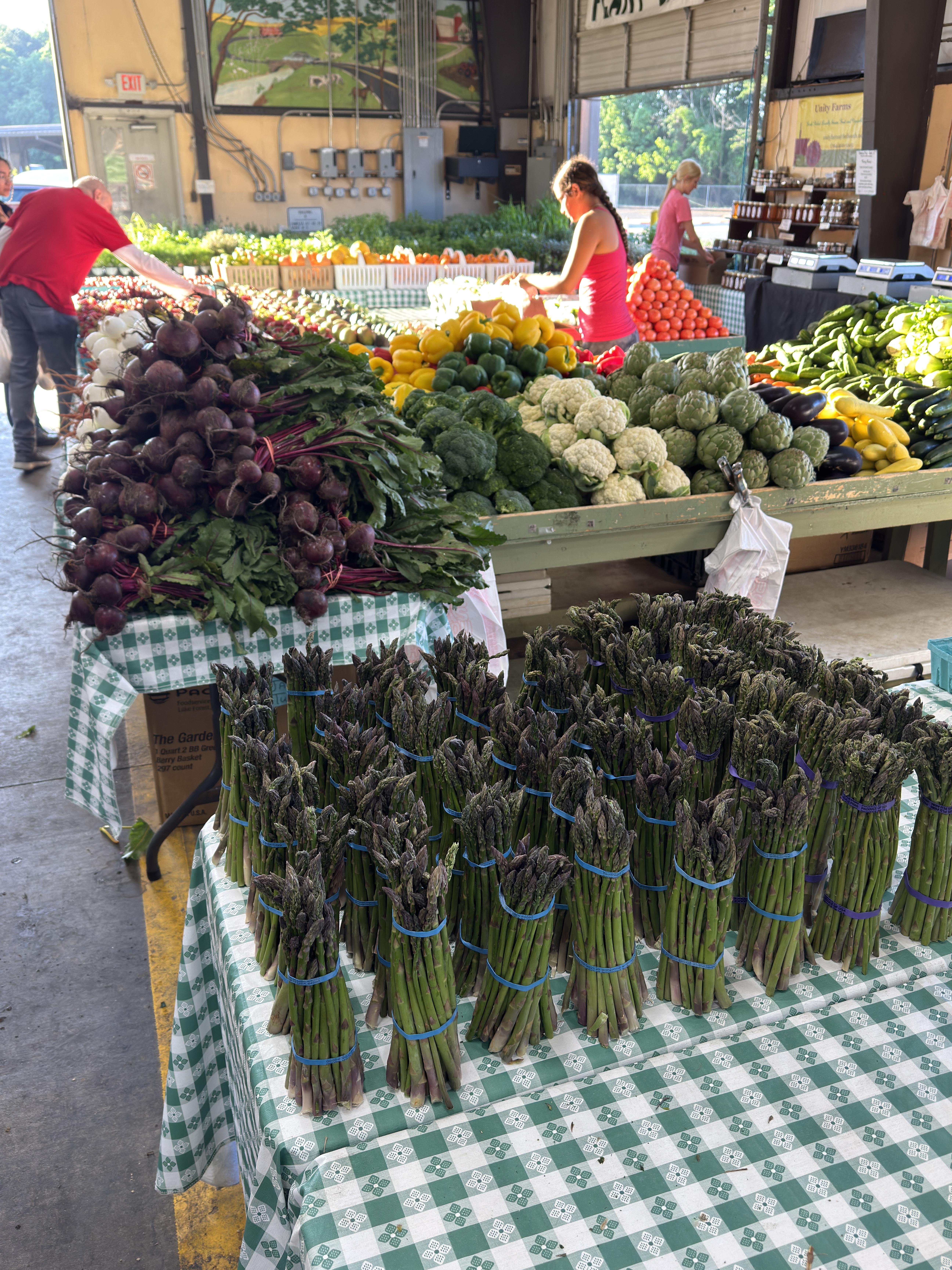 The Unity Farms stand stocked with fresh seasonal produce